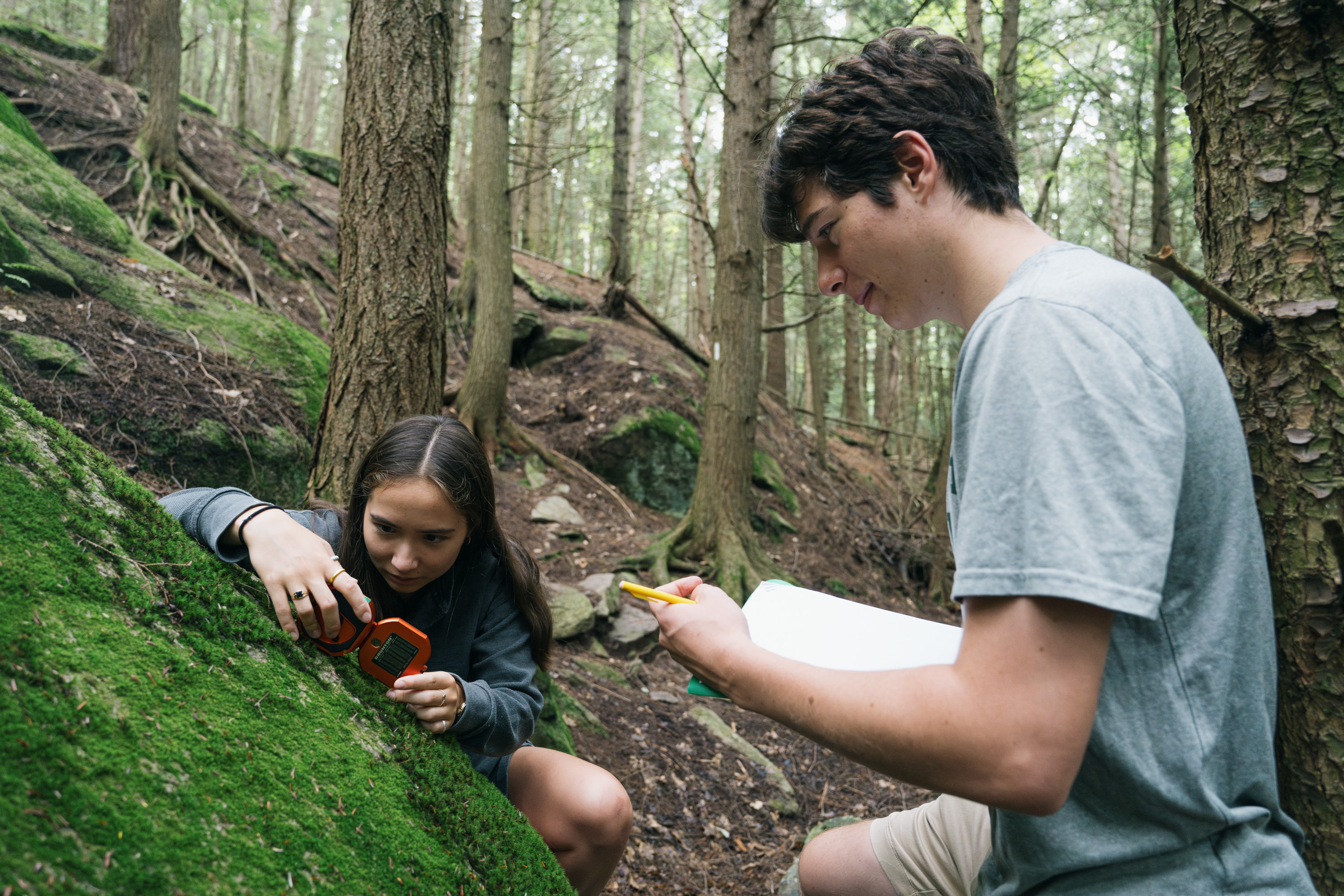 Students measuring rock formations