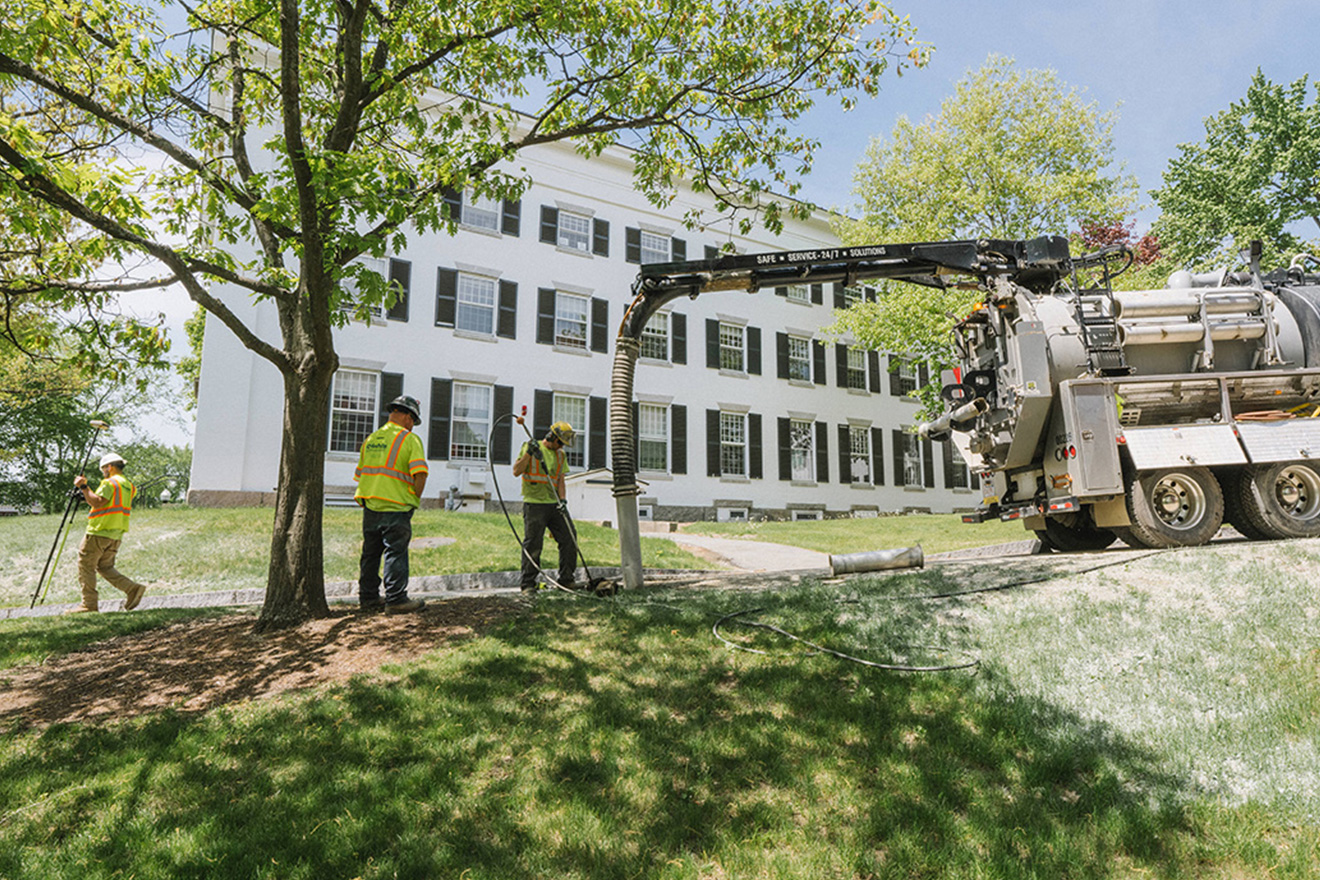 Construction in front of white building